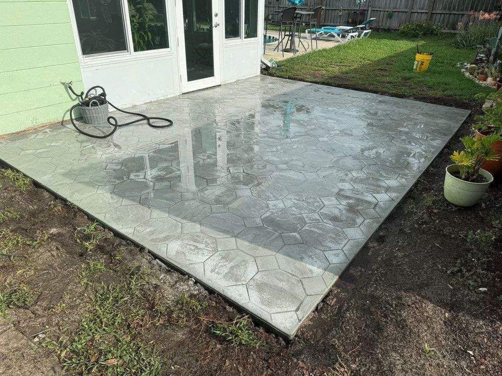 Same backyard with a new stamped concrete patio